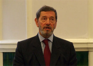 Head and shoulders shot of David Blunkett in suit and red tie