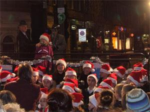 Sandy Campbell of Leith Festival watches  the Choir of St. Mary's Primary School