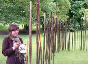 Susie Brown with palette on a sunny afternoon in front of her bamboo shoots