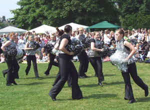 with silver pompoms running in a circle