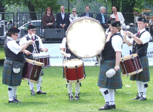 Young men in the pipe band drumming