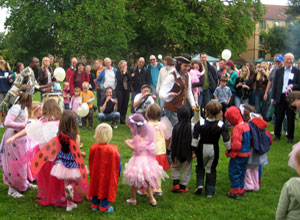 The children lined up with Superman, Batman, a Power Ranger and Spiderman, among the fairies