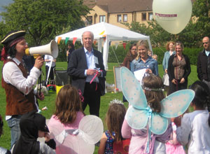 Pirate Paul with a megaphone, little girls (and Batman) dressed in pink as fairies, with the judges looking on