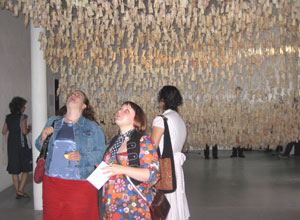 Two women looking up from underneath the figures to the rear of Return of the Soul