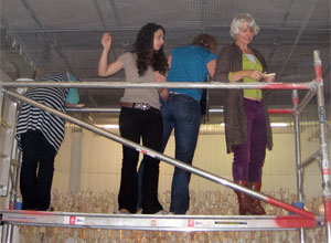 Four women on the scaffolding platform