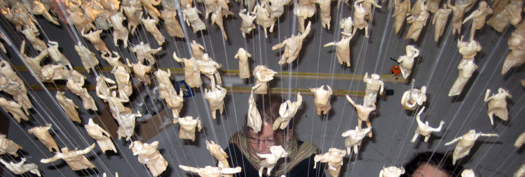 View of the figures from above as helpers wait for them to be lowered down