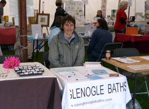 Sandra seated at the Save Glenogle Baths stall