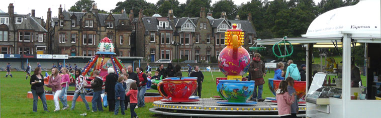 Young people and children enjoying the roundabouts