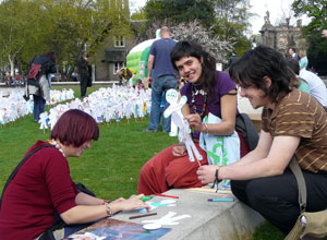 Young women creating their cutout people