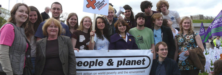 The Student Action on World Povery and the Environment group posing with their People and Planet banner