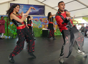 Desi Bravehearts dancing hip hop style in red and black tunics with baggy black pants