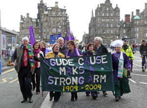 The politicians march down the  North Bridge with the  banner "Gude Cause Maks a Strong Arm 1909-2009"