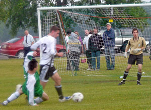 Hibs Legend going down at  Leith's goal after a strong tackle