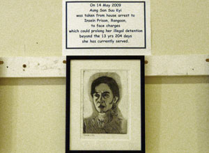Framed black and white etching of Aung Suu Kyi