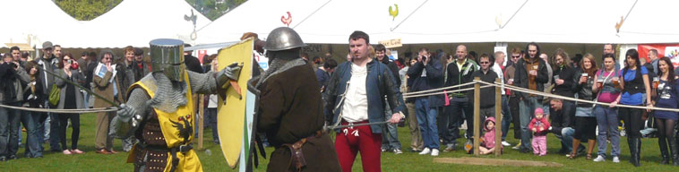 Two knights jousting as a referee as watching Leithers enjoy their beer