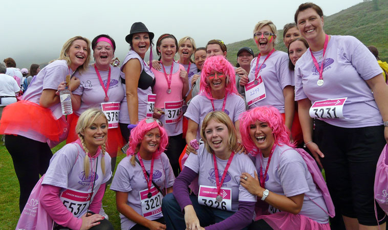 Group of women in lilac Tanz: Race For Life tee shirts