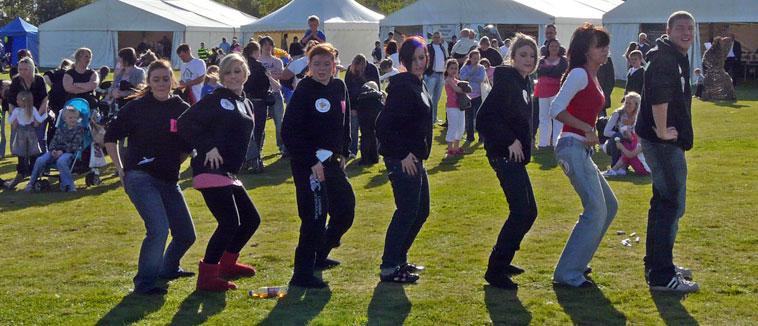 Line of seven young people sequence dancing