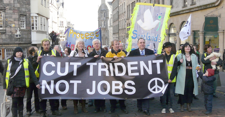 Cut Trident Not Jobs banner with the CND symbol carried up the Royal Mile, by marchers including Leslie Riddoch, Mark Lazarowicz, John Barrett and Alex Salmond who pause for a chat at the top of the Royal Mile