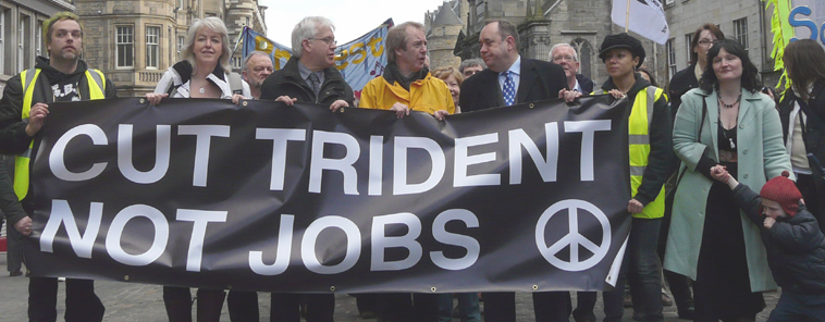 Cut Trident Not Jobs banner with the CND symbol carried up the Royal Mile, by marchers including Leslie Riddoch, Mark Lazarowicz, John Barrett and Alex Salmond