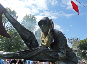 Man with gas mask and long claws over his arms