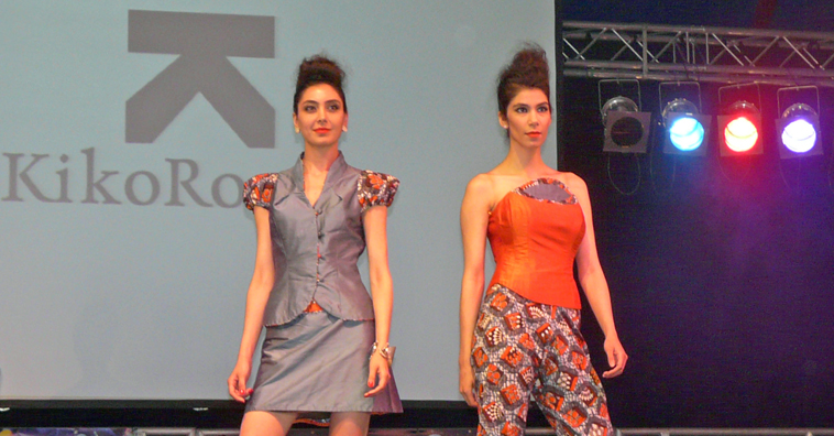 Two women in grey and orange outfits