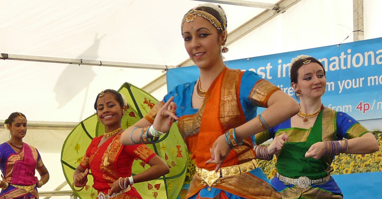 Three women dancers telling a story with their hands