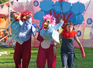 Lions with chicken puppets creeping up on the audience