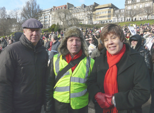 Malcolm in flat cap, Gordon in  cap with hangning ear flaps, Lesley with red scarf