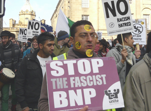 Young man with Anti Nazi League stickers on his face