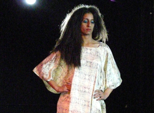 Woman in white dress with purple patterning