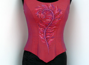 Close up of a pink satin basque embroidered with a pink, and purple design