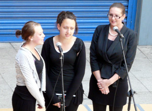 Three young women singing
